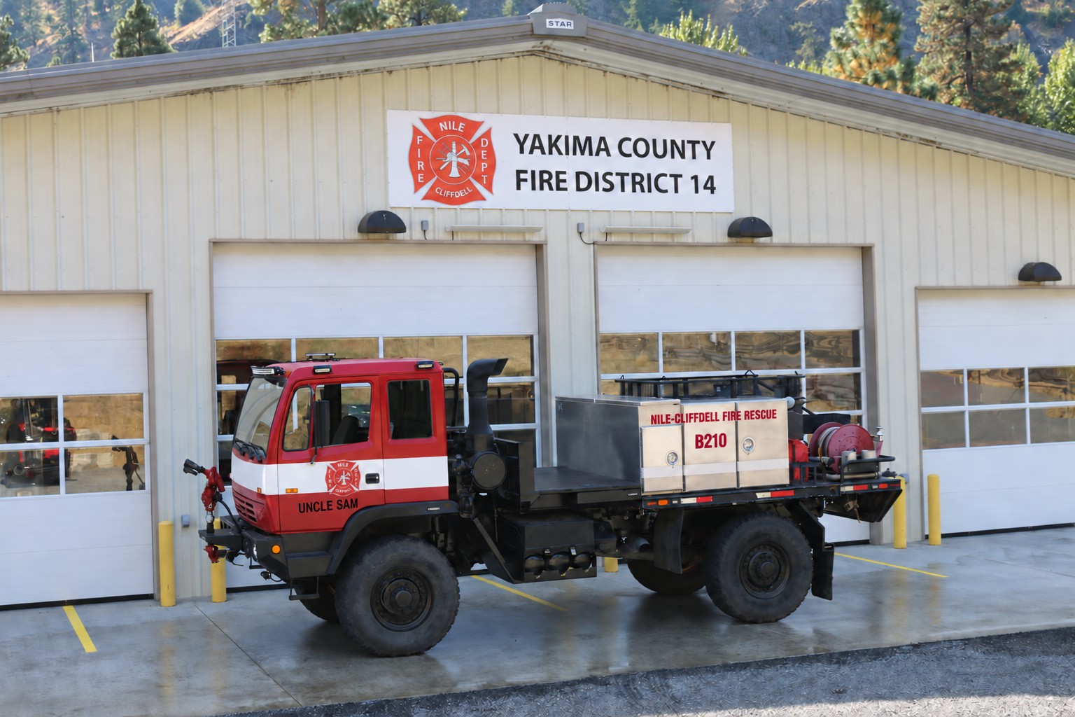 Brush 210 Uncle Sam military LMTV brush truck posed outside Yakima County Fire District 14