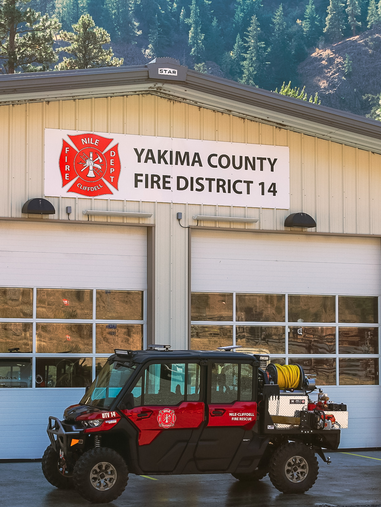 UTV 14 Desmond posed outside Yakima County Fire District 14