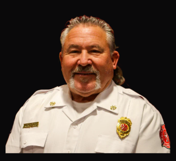 Deputy Chief Kevin Paxton in a white command uniform