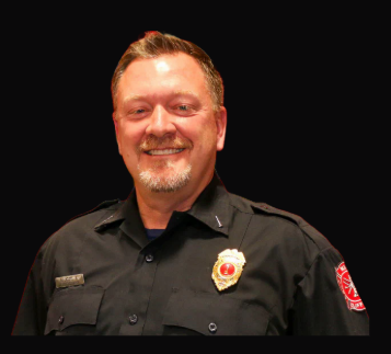 Lieutenant Shawn DeCicco in a dark department uniform