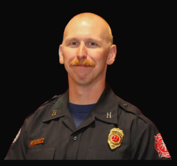 Captain Torson Iverson in a dark department uniform