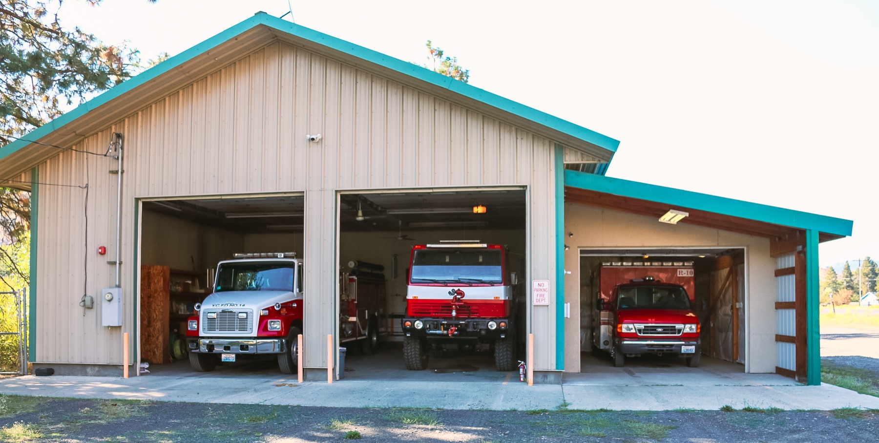 Station 10 with its apparatus-bay doors open and district response vehicles inside