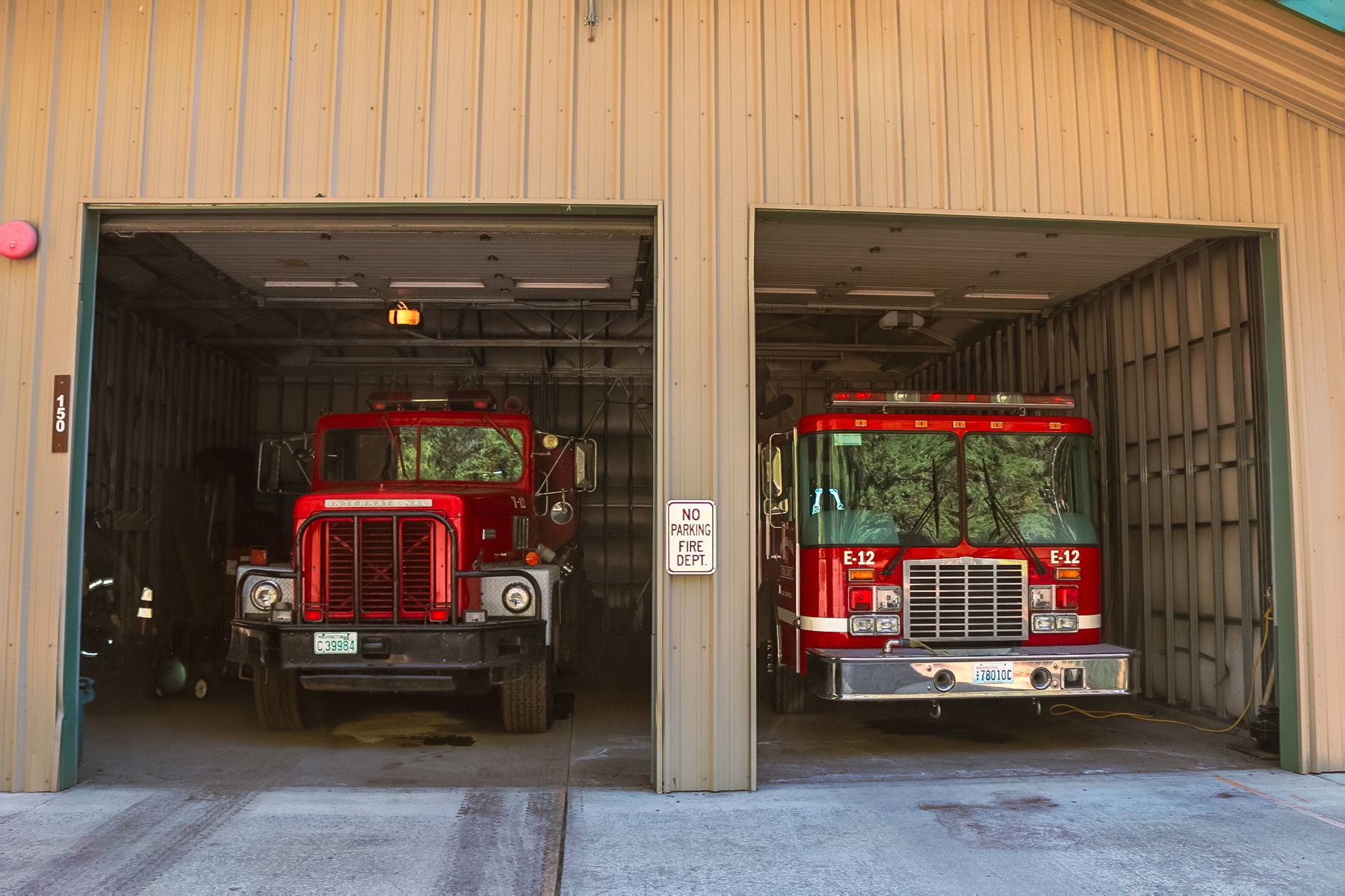 Station 12 apparatus bays open with Engine 12 and Tender 12 inside